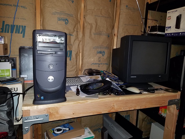 The disaster area that is my computer setup right now.