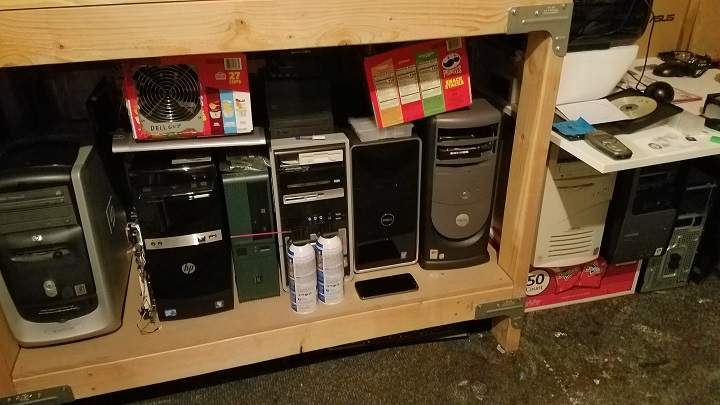 All of my computer junk under my workbench.