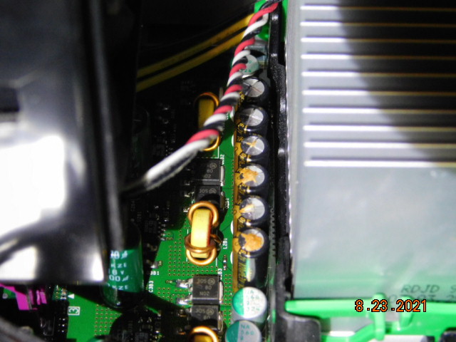 The blown capacitors on the motherboard.