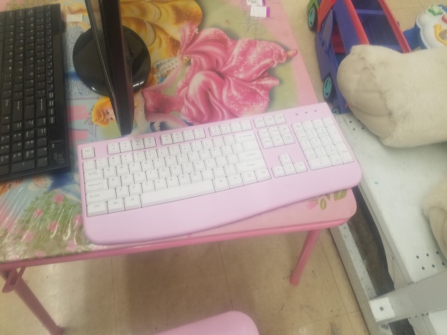 The cheap pink keyboard & desk.